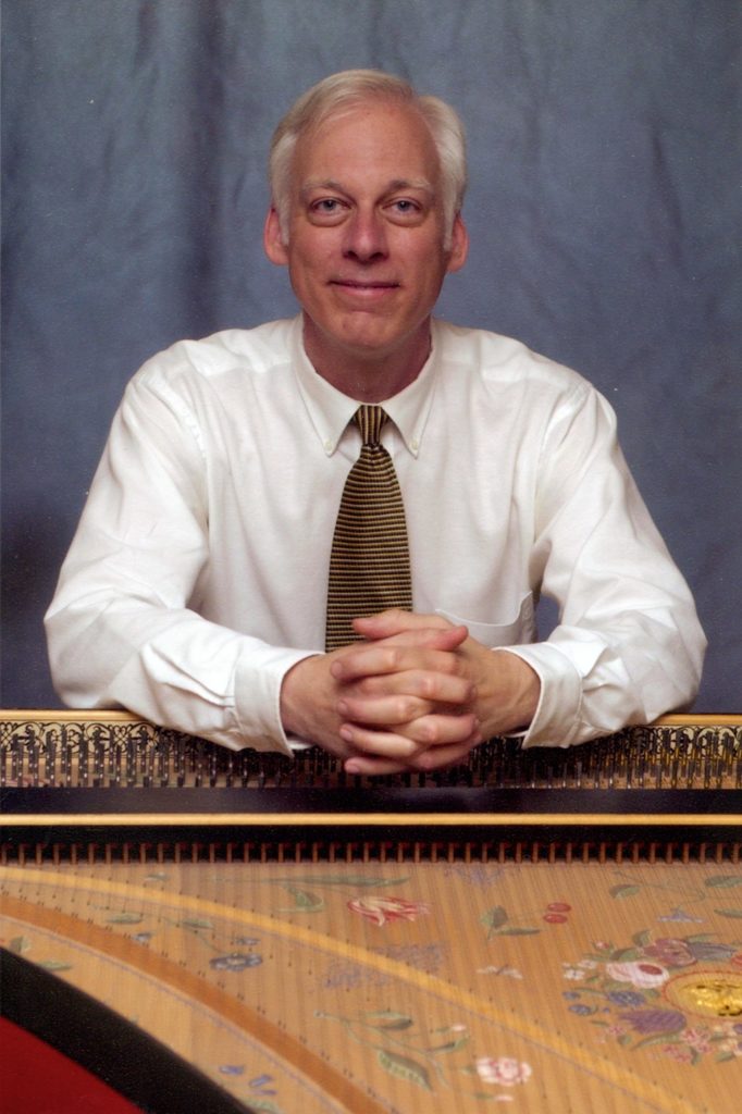 Dr. Gregory Crowell with a harpsichord